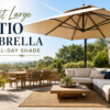 Large patio umbrella providing shade over comfortable outdoor seating and dining areas.