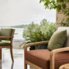 Cozy wooden patio chairs with waterproof outdoor seat cushions surrounded by lush greenery and a scenic view