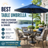 Table umbrella providing shade and comfort over an outdoor patio dining table.